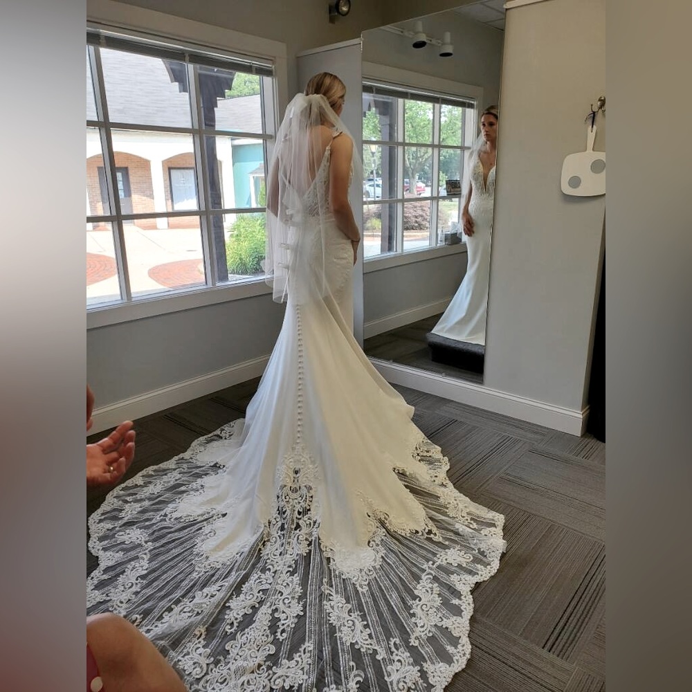 Ivory appliqué wedding dress with train